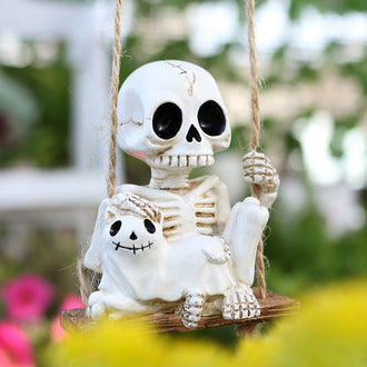 Swinging Skeleton and Cat Figurine